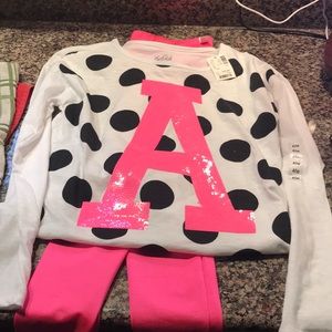 Justice leggings and top with letter A- neon pink.